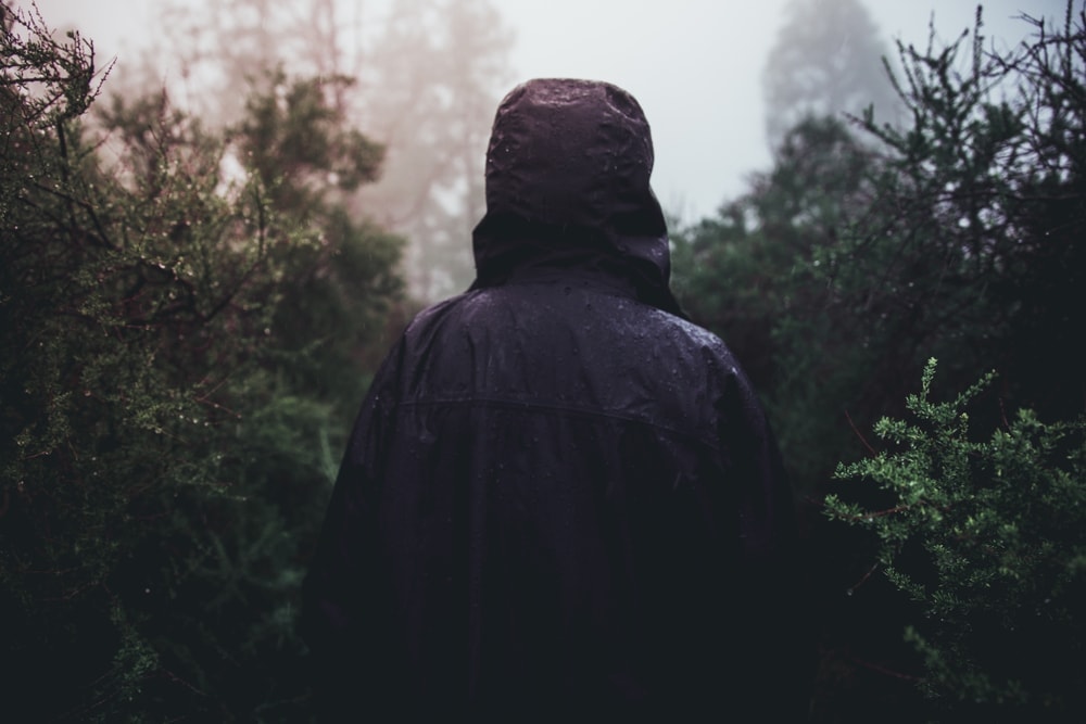 Person under rain wearing a rain jacket