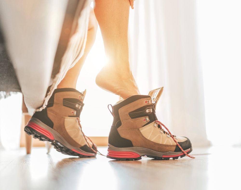 Woman stepping in boots