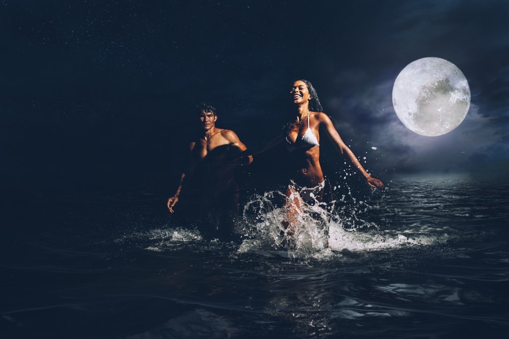 Couple in the beach at night