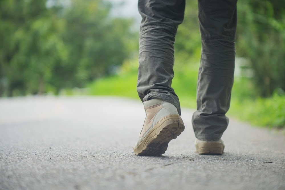 Man walking with hiking boots on street