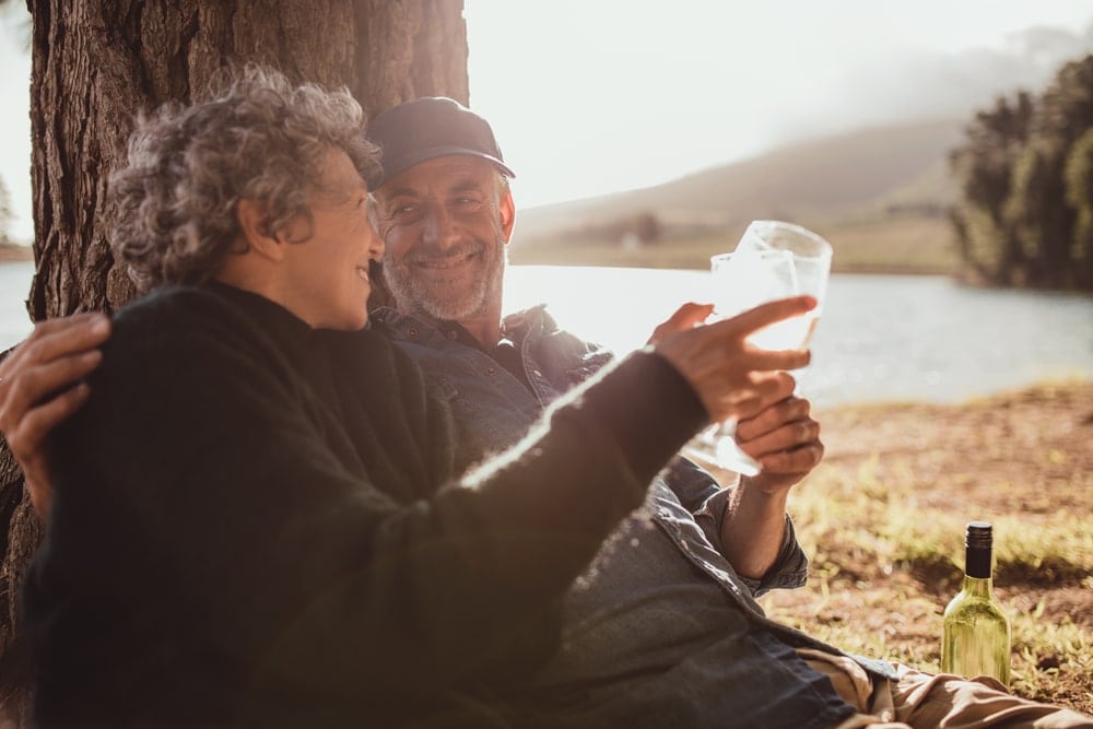 Couple holding wine glasses on a date