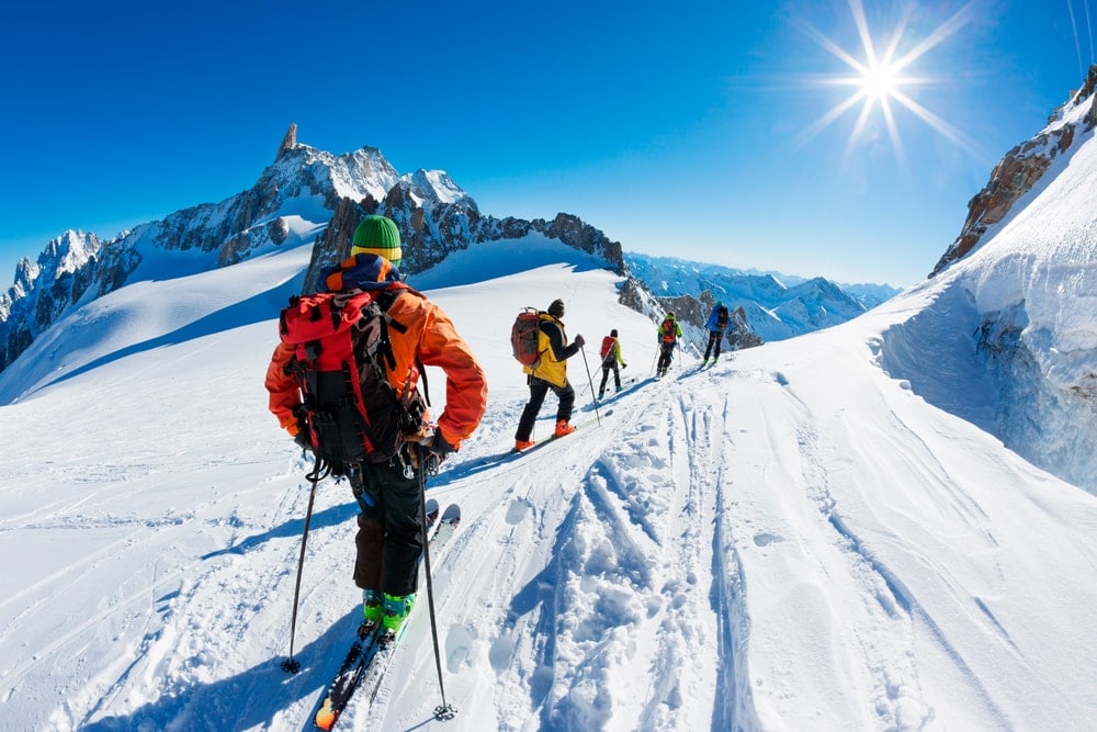 a team of climbers mountaineering during winter 