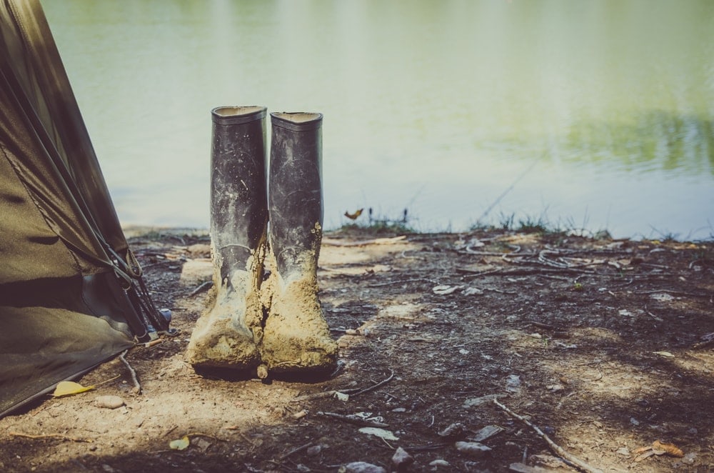 Dirty boots standing near tent