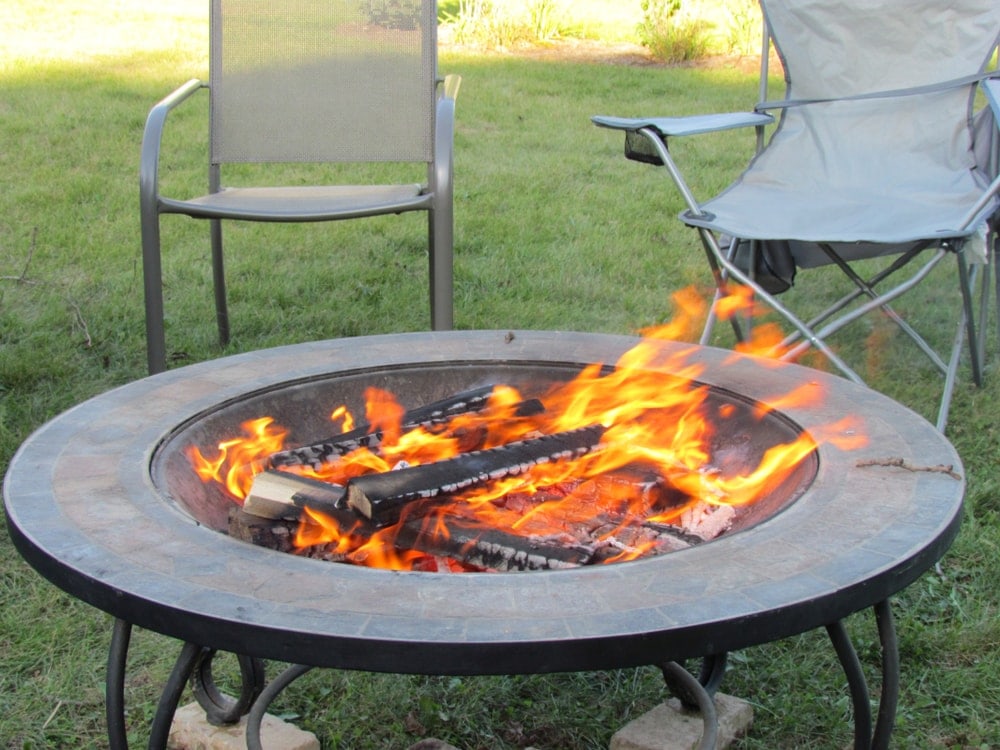 Portable fire pit with burning fire