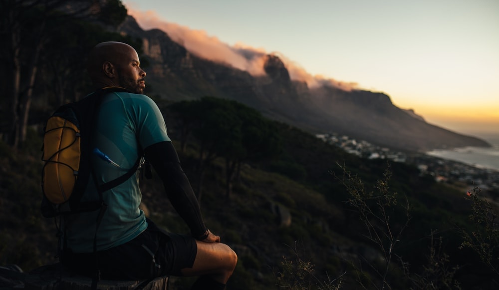 Man resting while during camping and hike