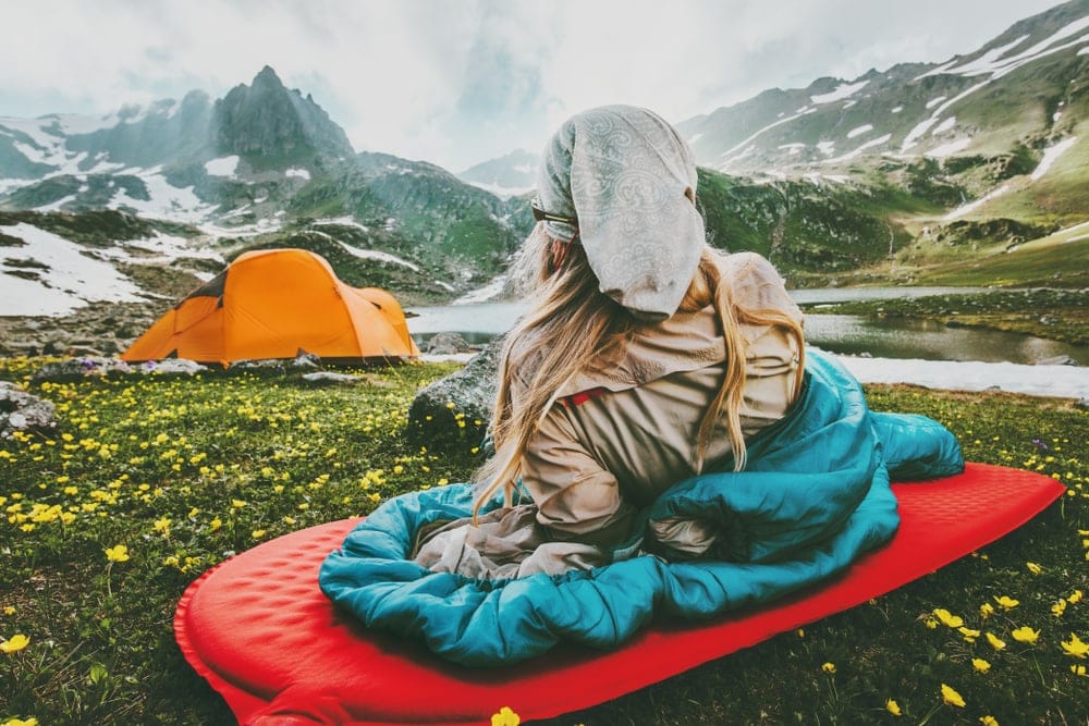 Woman looking at her camping tent