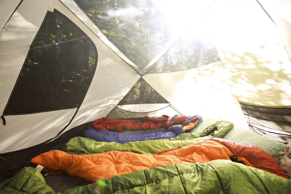 Sleeping bag lining up inside a camping tent