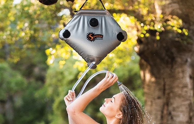 woman showers while camping