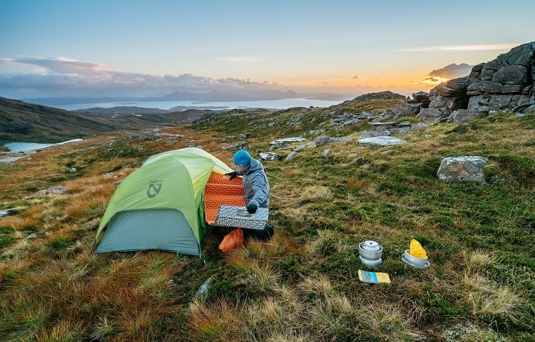 man preparing tent