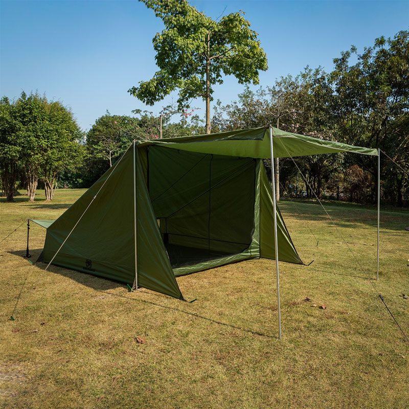 image of a baker tent opened in a field 