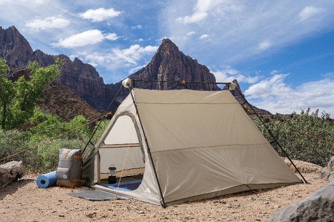 image of a triangular tent in a campsite 