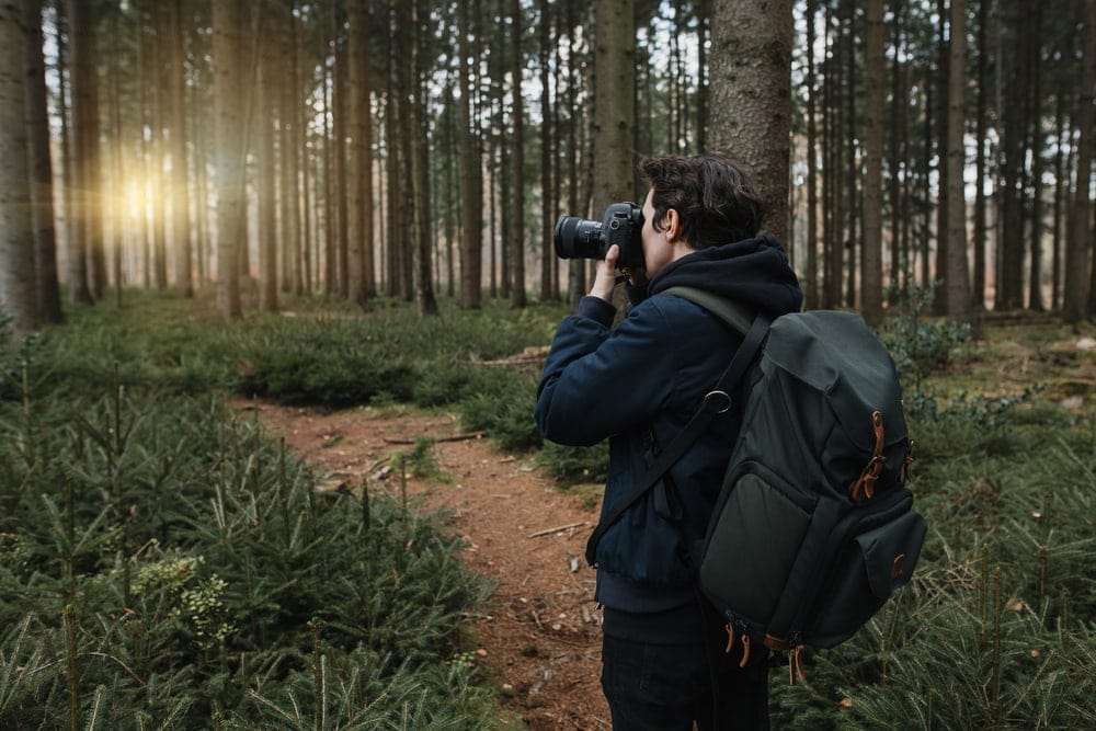 Hiker taking pictures during a hike