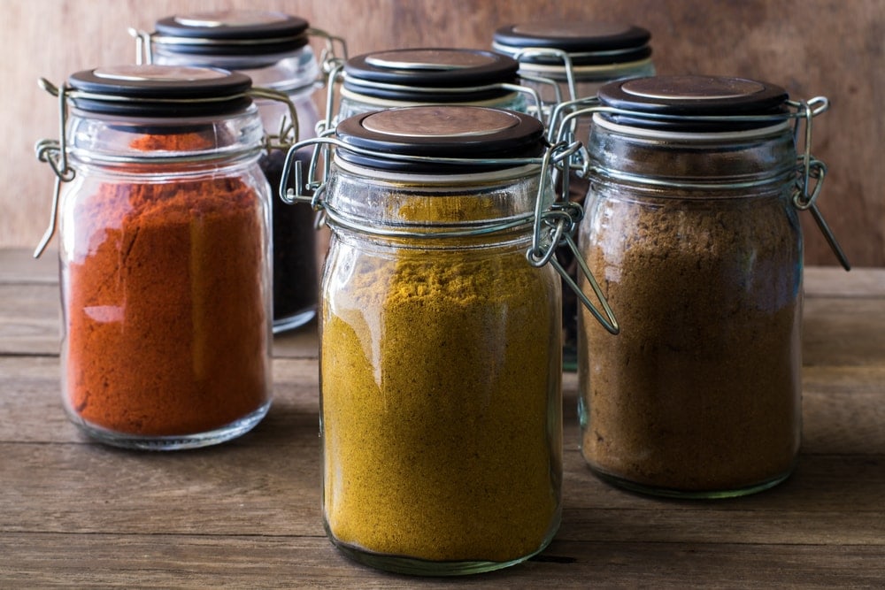 Jars of spices that can be used as raccoons repellents