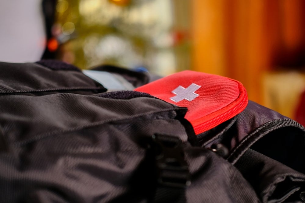 FIrst aid kit inside a backpack pocket