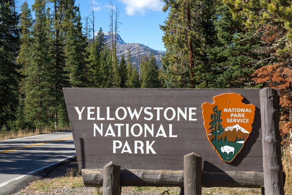 Yellow National Park sign beside the road