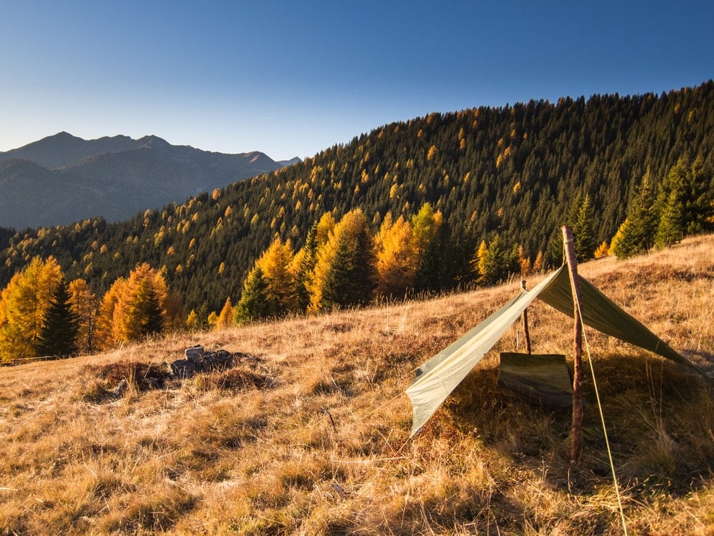 A camping tarp setup in the hills for cowboy camping
