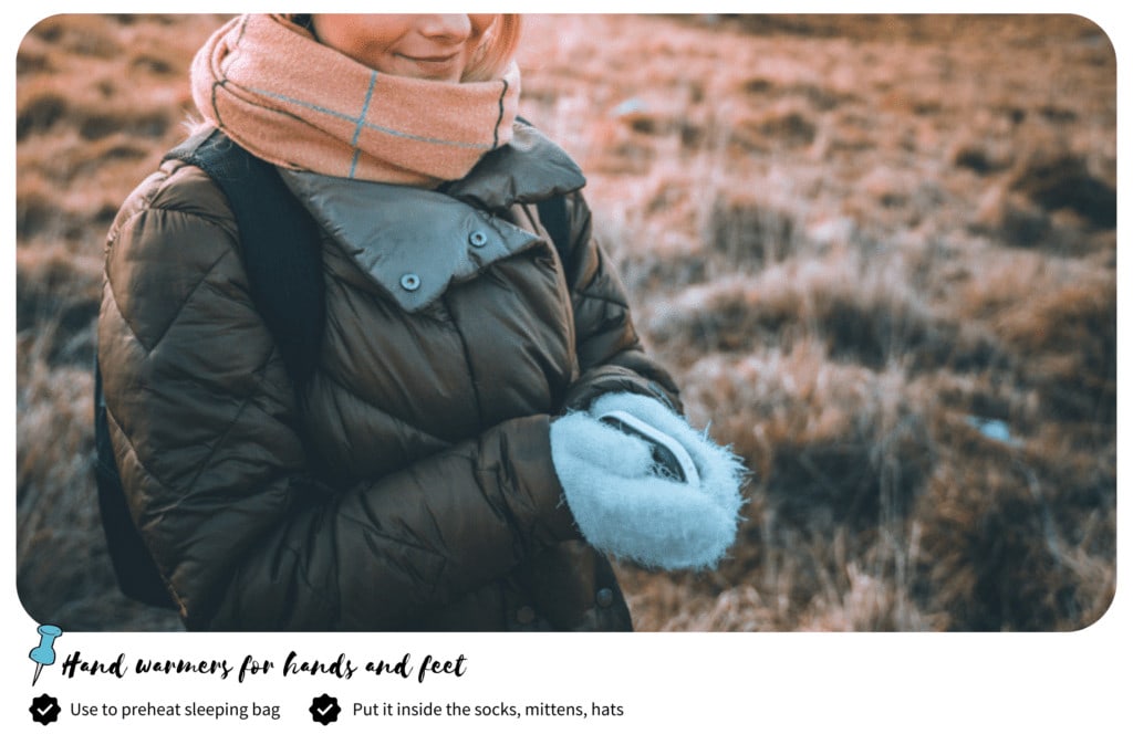 Hiker holding a hand warmer