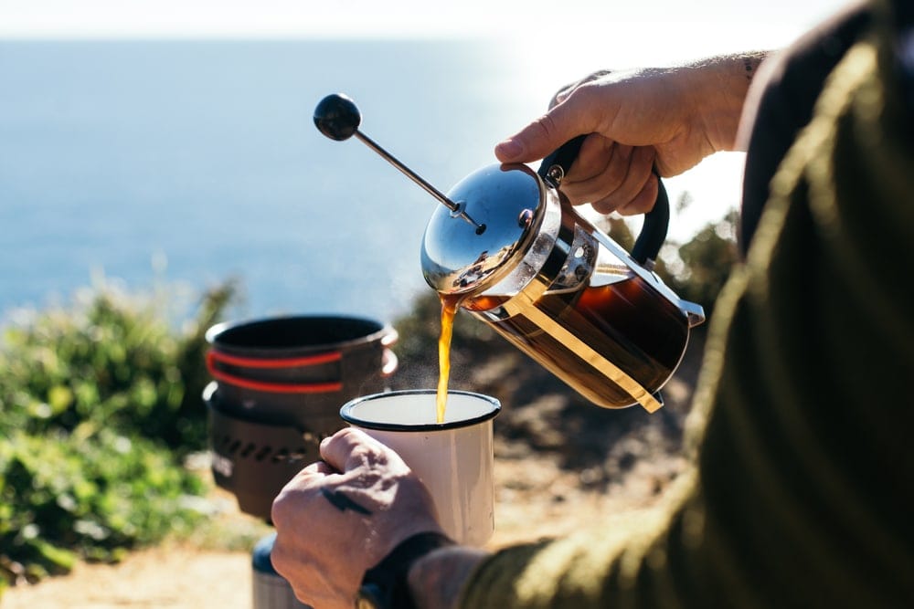 Man pouring a coffee from a french press