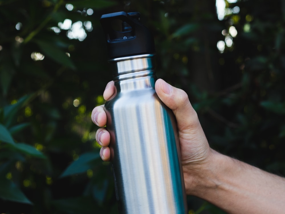 Man holding a hiking bottle