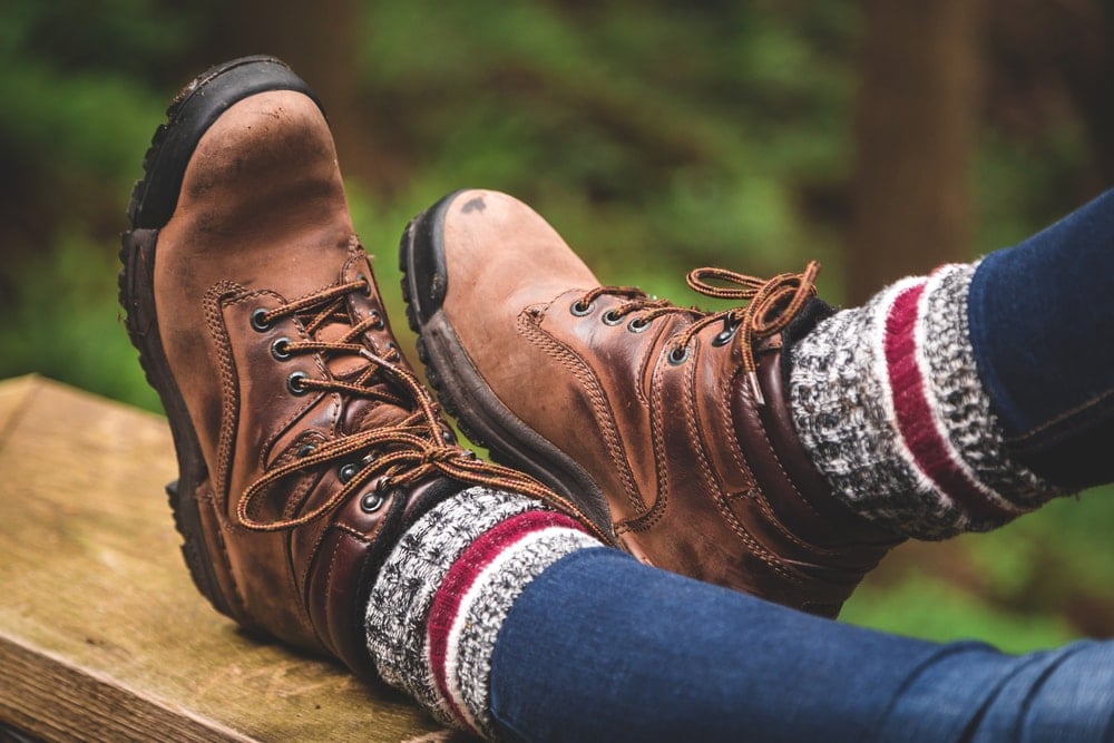 Woman wearing a hiking boots with high socks