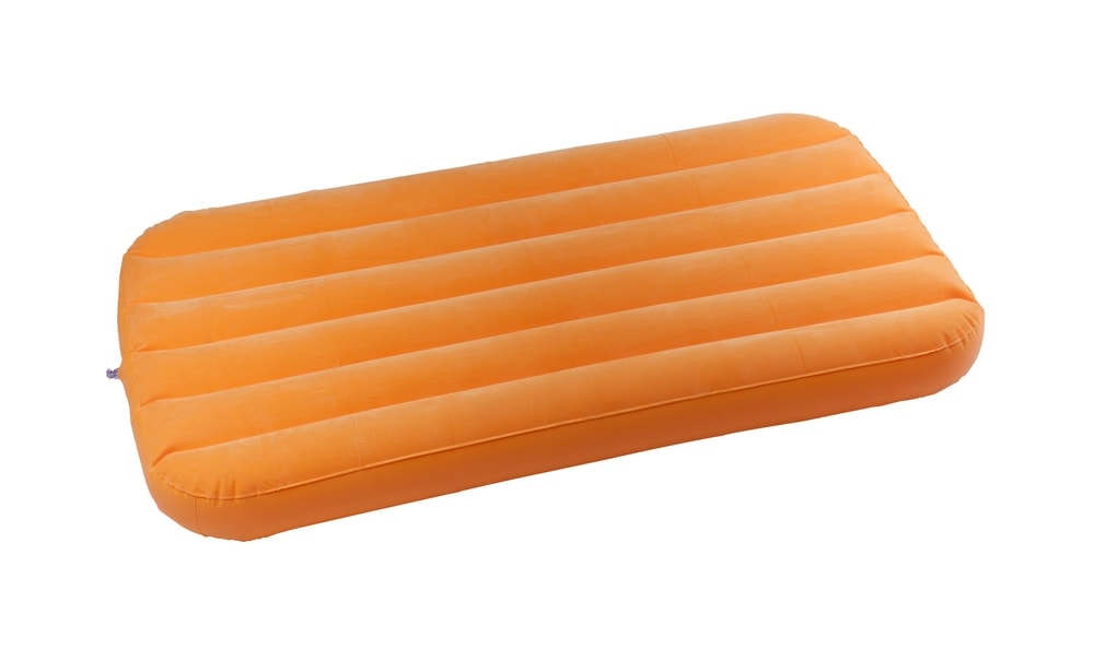 Orange inflatable air mattress for camping