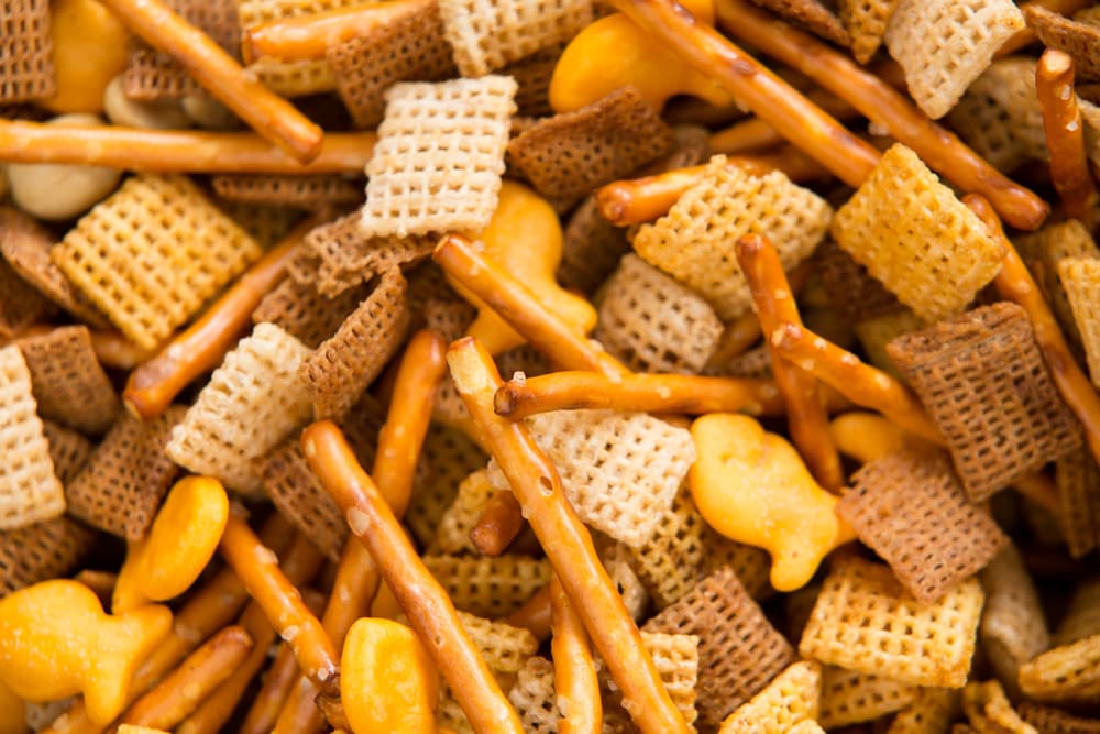 close up shot of a Chex party mix containing cereal, crackers and pretzels.