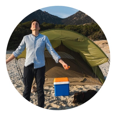 A man breathing a fresh air outside his tent