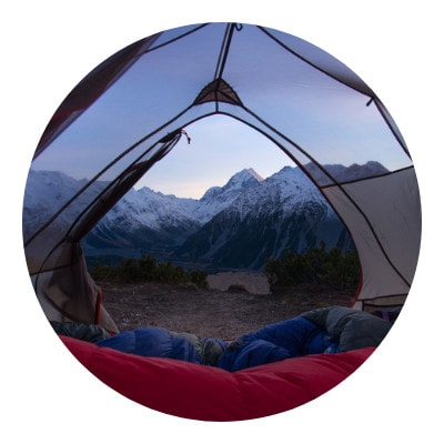 Blanket and comforter inside a camping tent