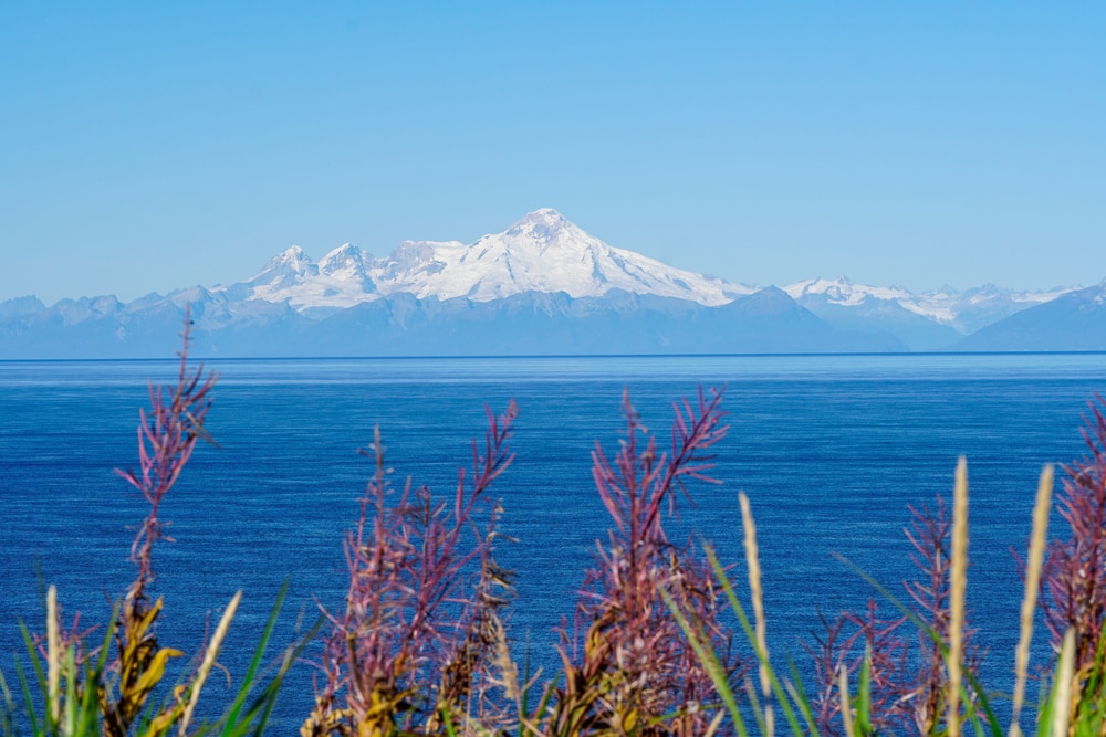 Lake Iliamna of Alaska with frozen mountain in the background