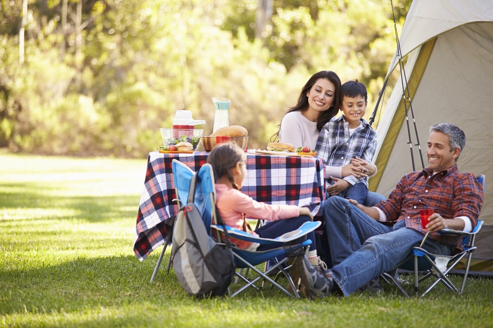 a family enjoying camping with their tent 