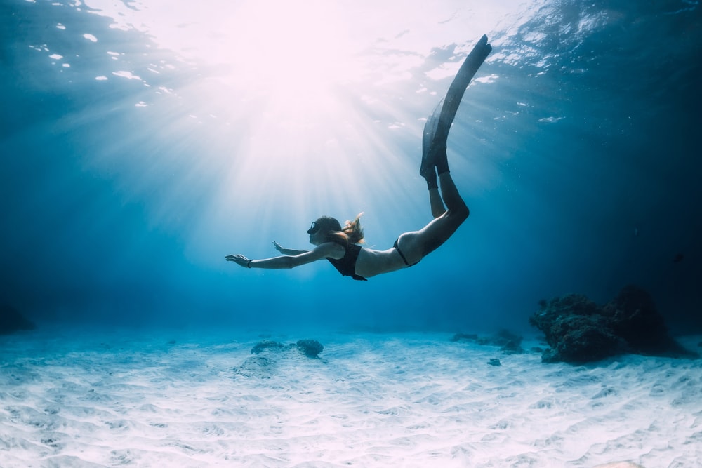Woman diving into the ocean