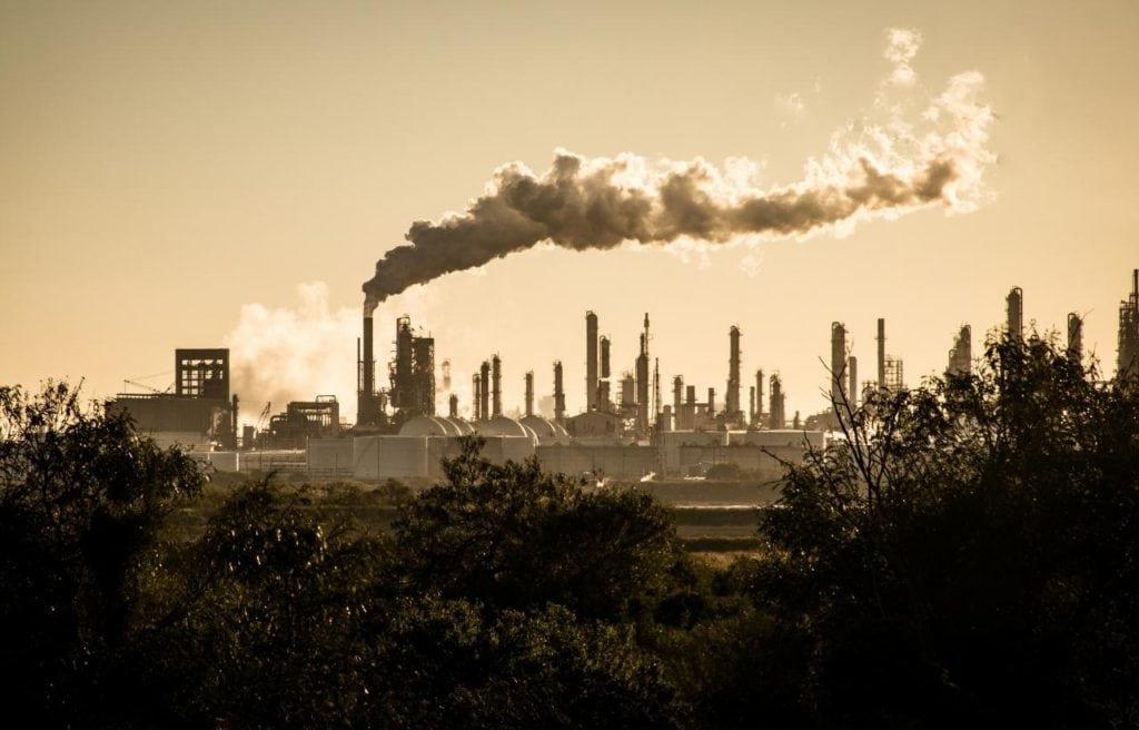 factories emitting smoke that causes climate change