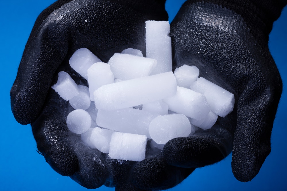 Dry ice holding by a man with gloves
