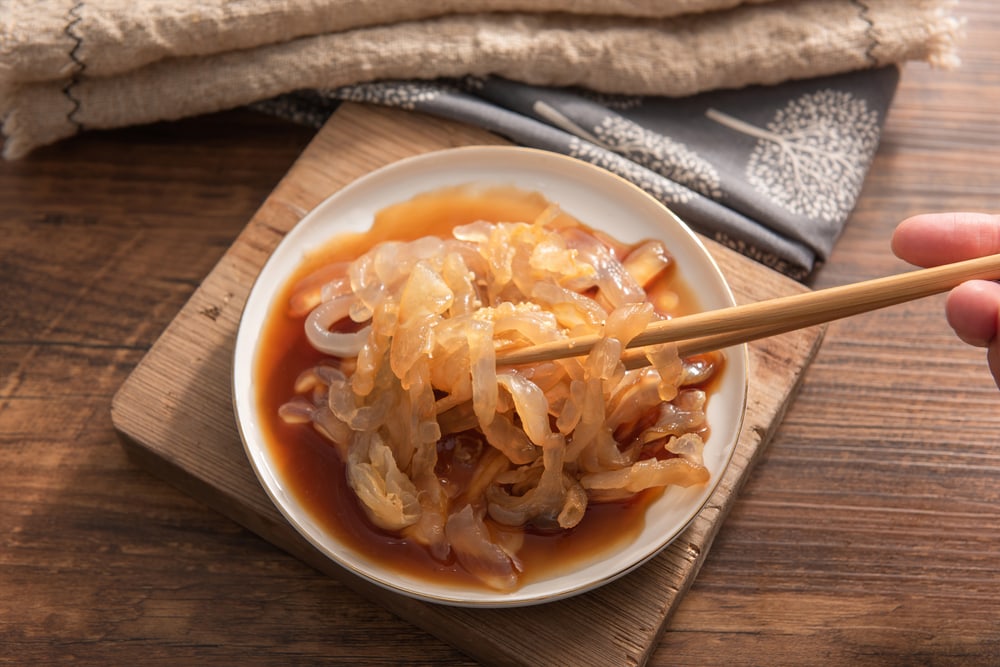 a pickled jellyfish served in a bowl 