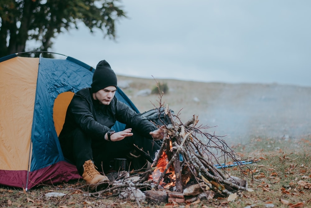 image of a man warming up his hands 