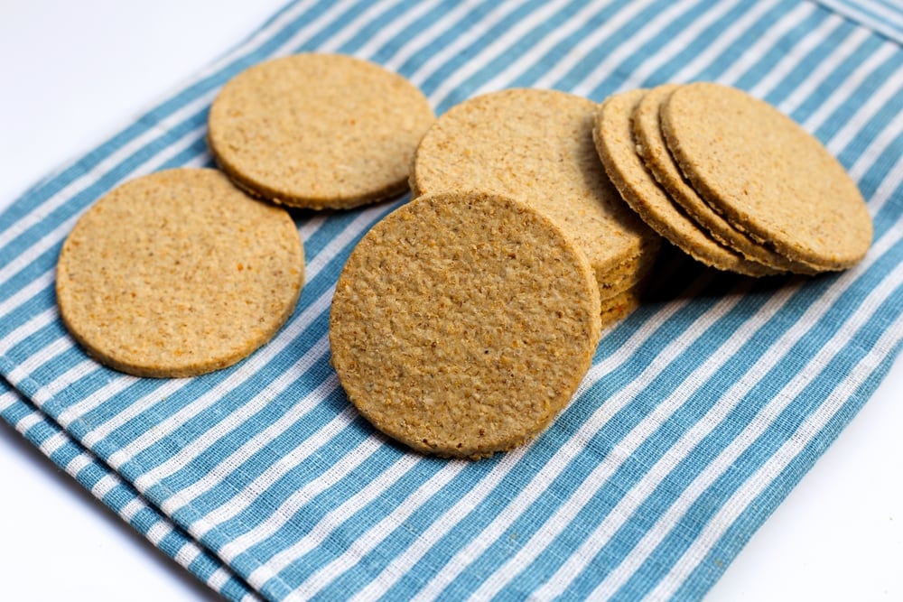 Oatcake laying on a blue-striped clothe