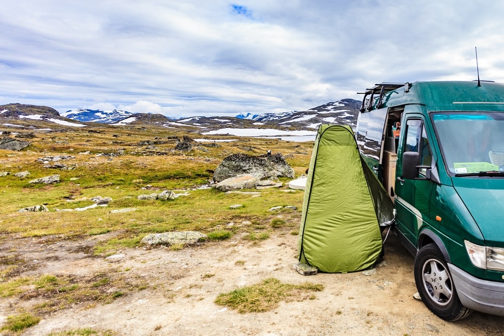 a privacy tent beside a campervan