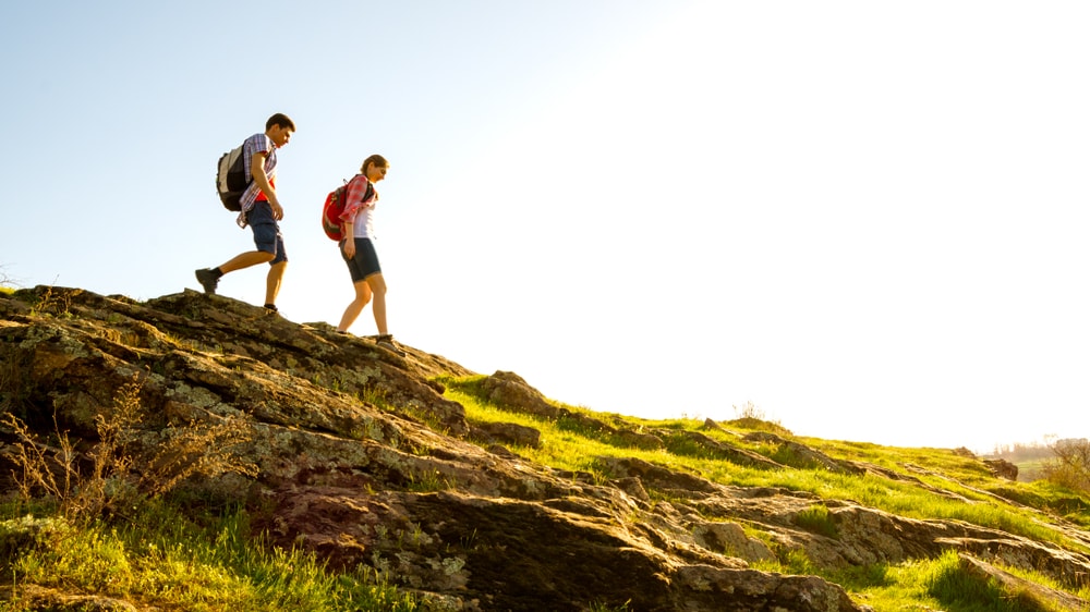 A couple on a rocky mountain trail