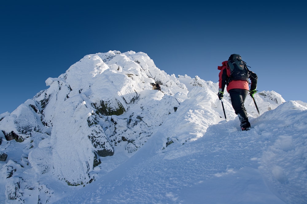 A hiking on a a snow-covered mountains