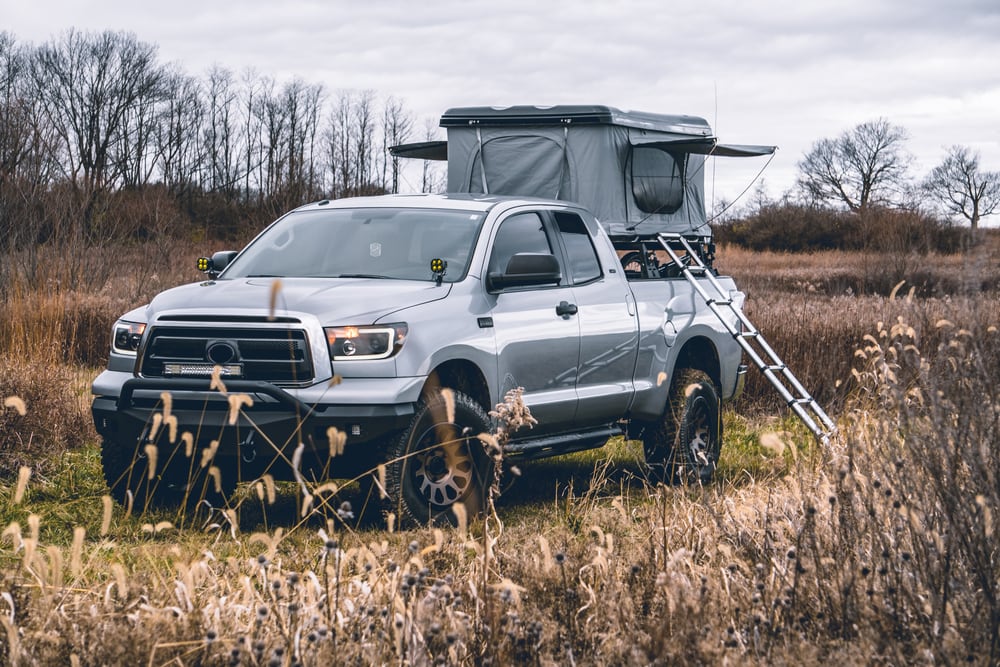 Pickup Truck with Roof Top Tent in Field