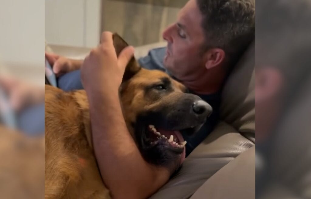 Rusty hugged by his dad