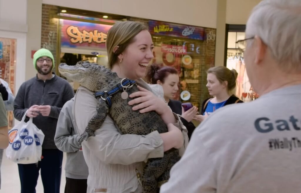 A mall goer holding Wally